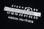 Black crew-neck T-shirt graphic: Maison Margiela numbers and logo print