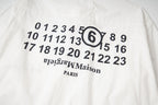 White button-up shirt back graphic with numbers and “Maison Margiela”