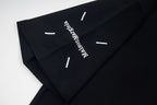 Black T-shirt sleeve with white number text and dash marks, short sleeve.