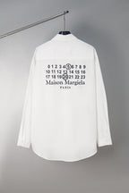 White button-up shirt back with numbers and Maison Margiela Paris print