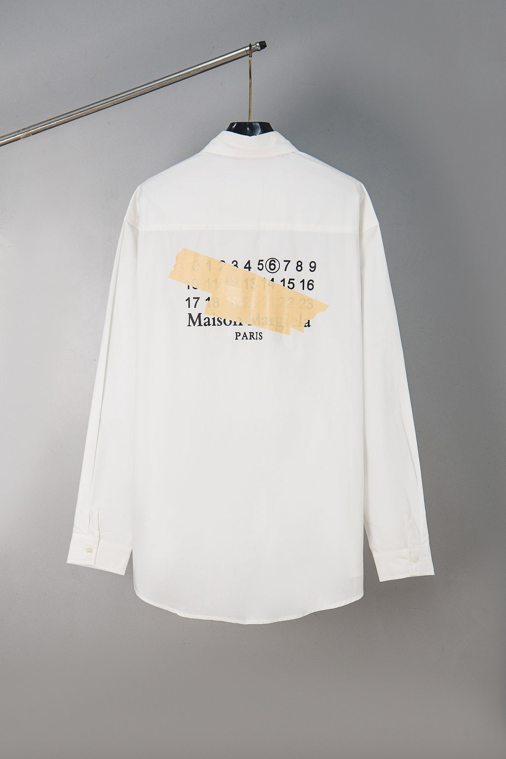 White button-up shirt with Maison Margiela back graphic and Paris text