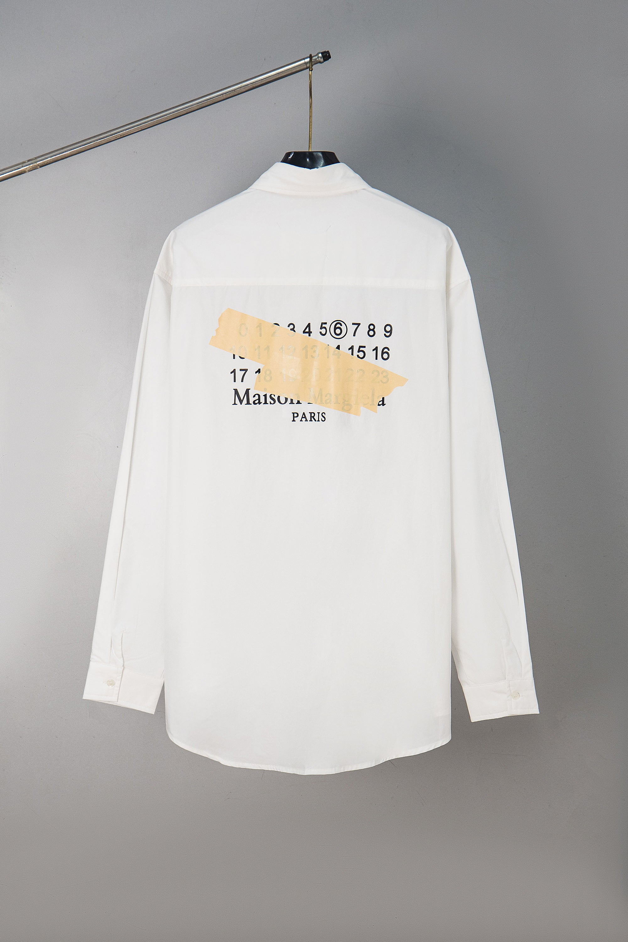 White button-up shirt with Maison Margiela back graphic and Paris text