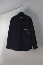 Dark navy button-up shirt with chest pocket and small Maison Margiela logo