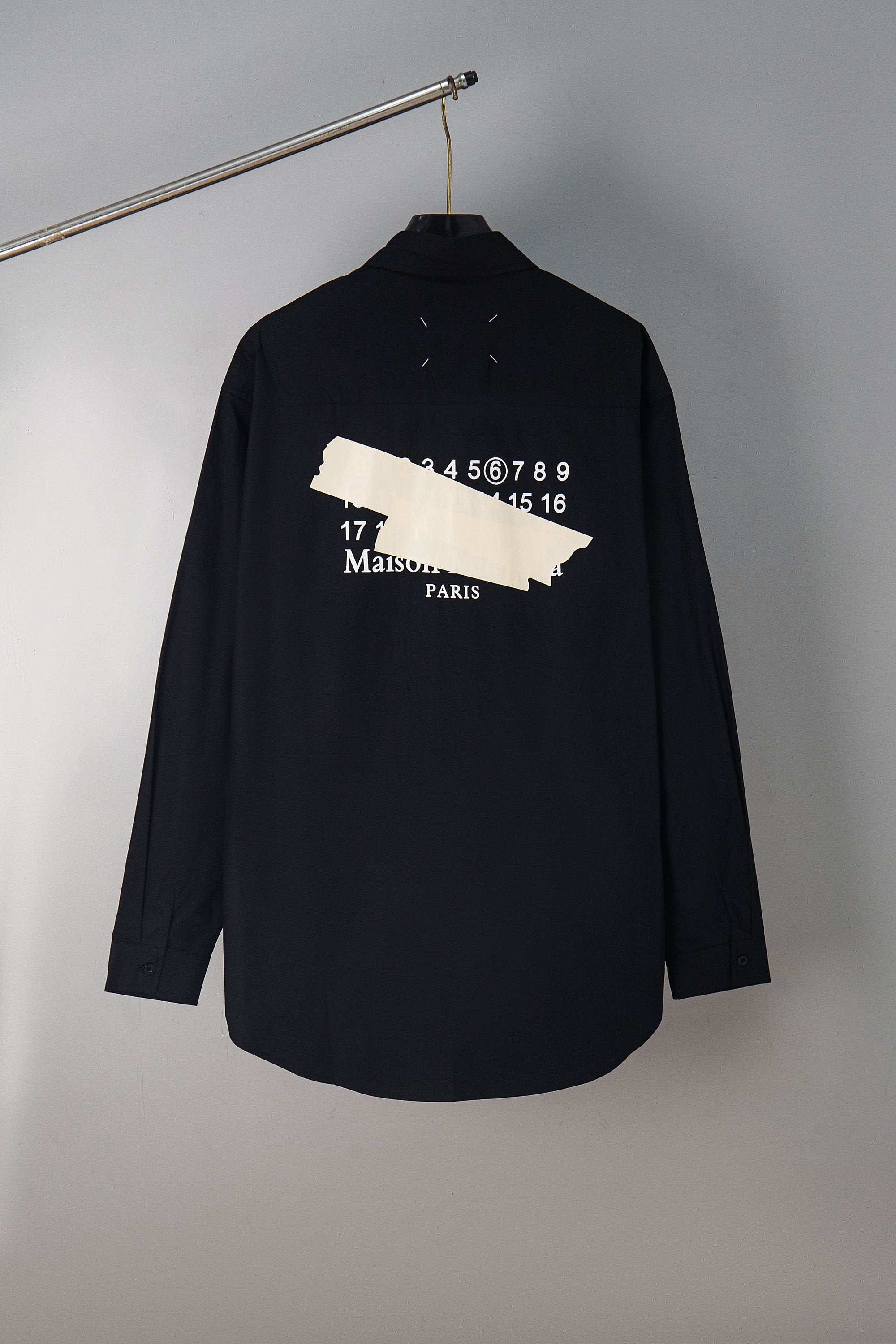 Dark navy button-up shirt with Maison Margiela back graphic and number pattern