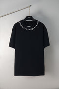 Black crewneck T-shirt with number graphic around neckline, short sleeves.