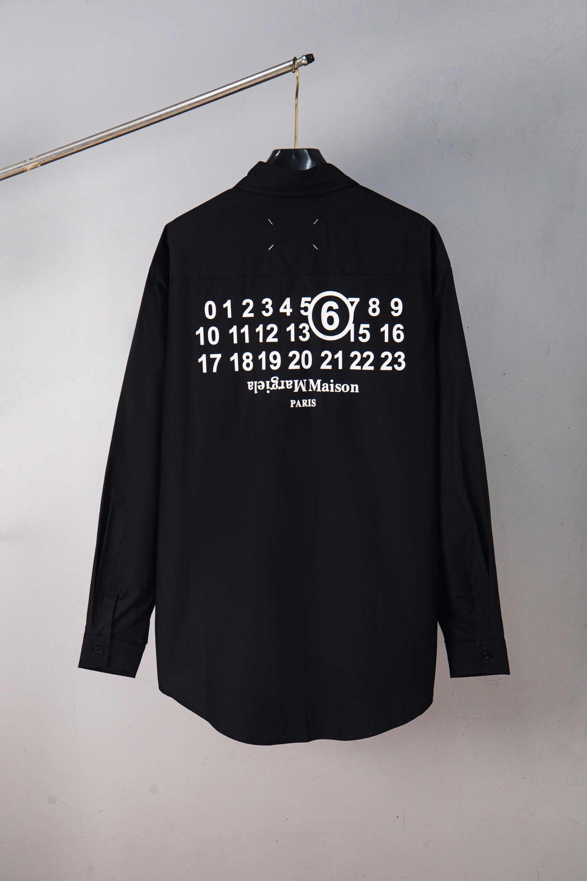 Black button-up shirt with large back graphic of numbers and “PARIS”