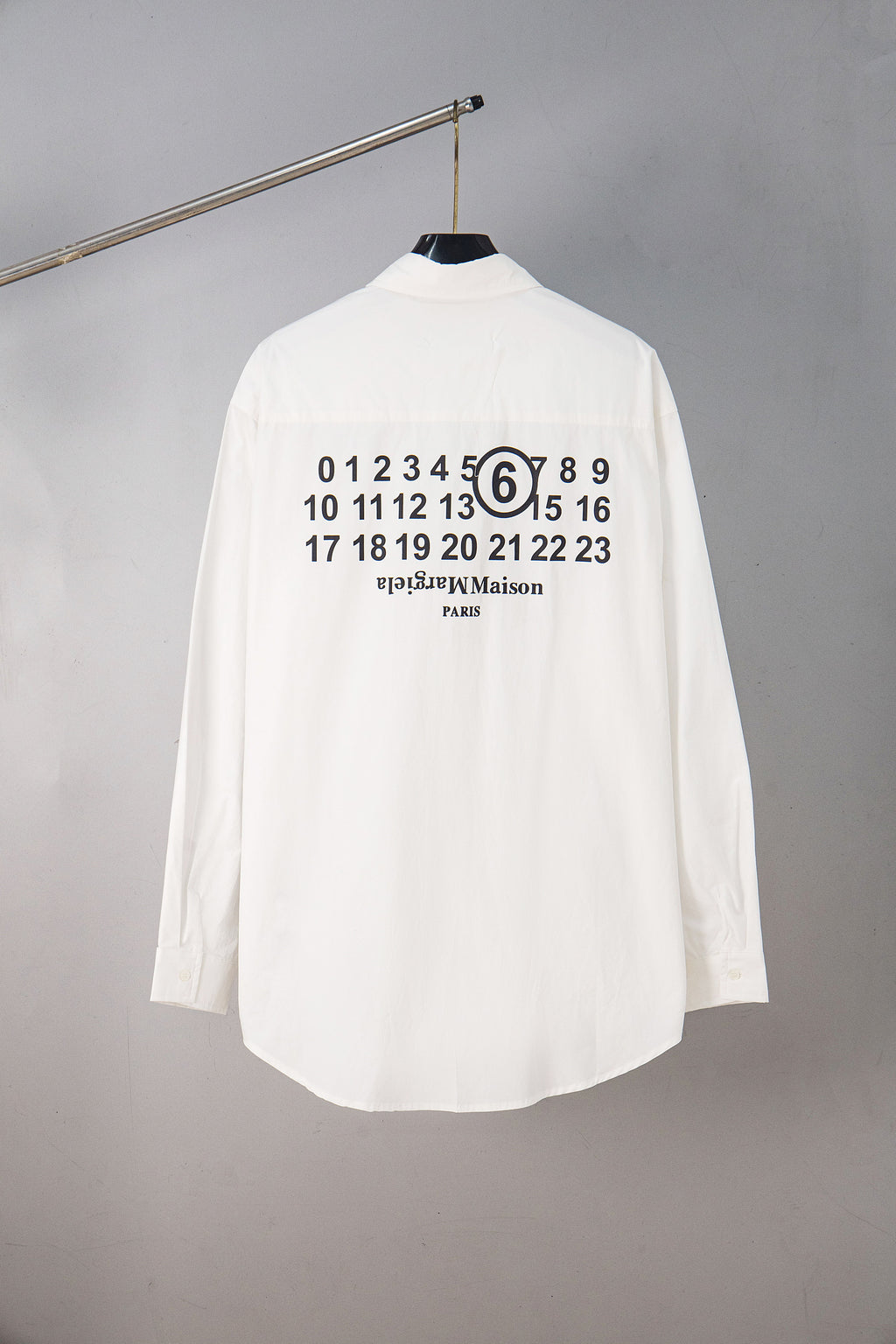 White button-up shirt with large back graphic of numbers and “PARIS”