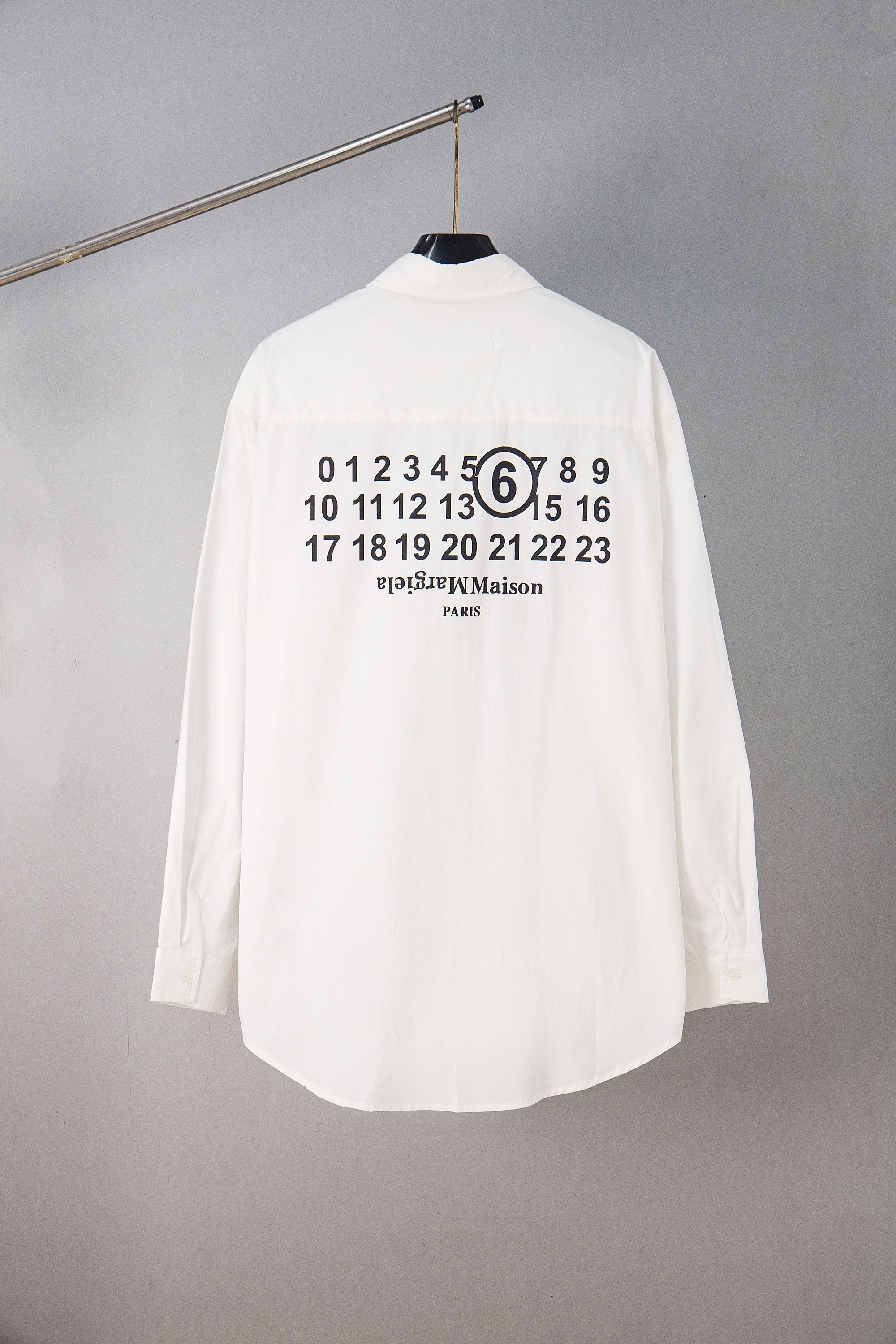 White button-up shirt with large back graphic of numbers and “PARIS”