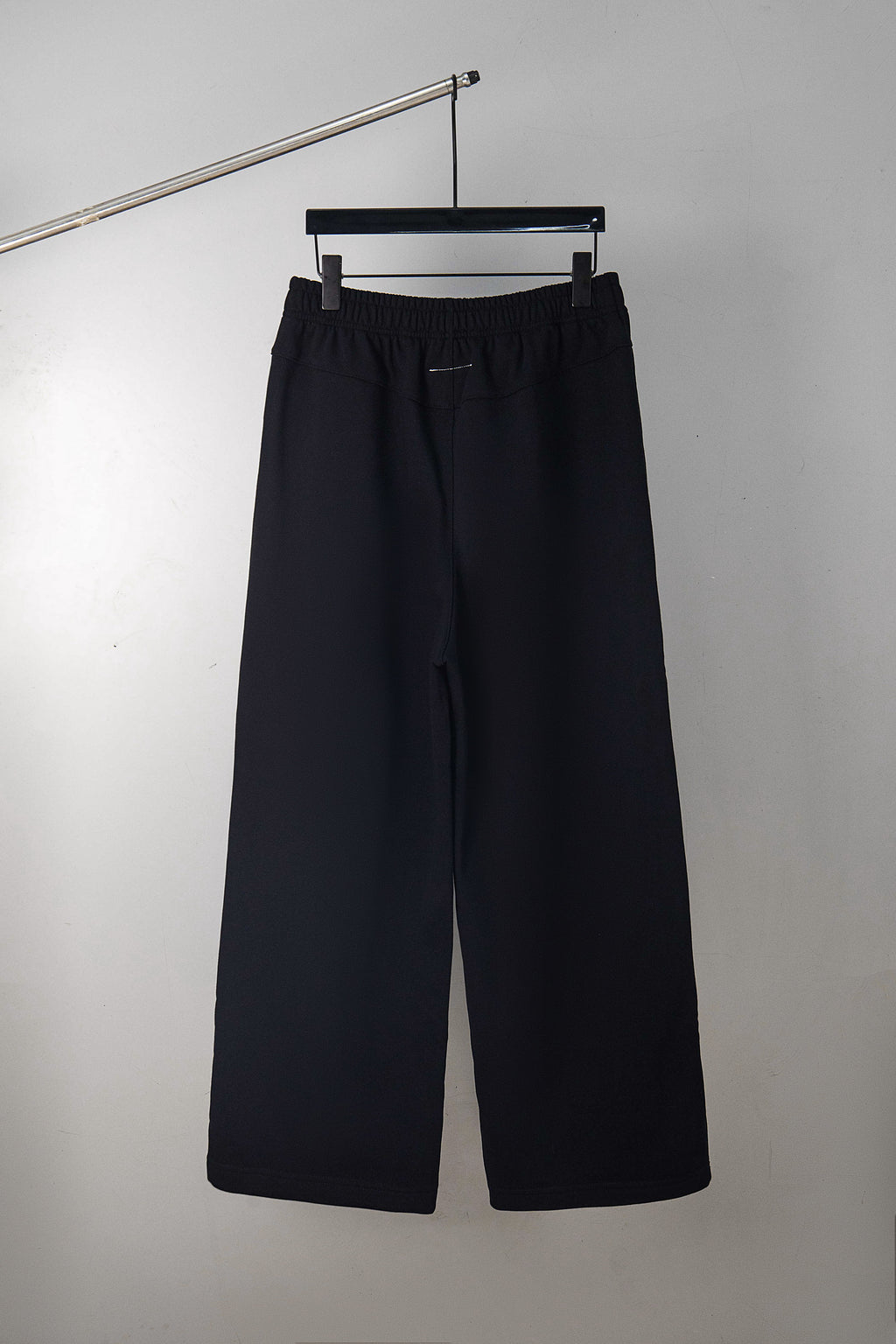 Dark navy wide-leg pants with elastic waistband and relaxed fit