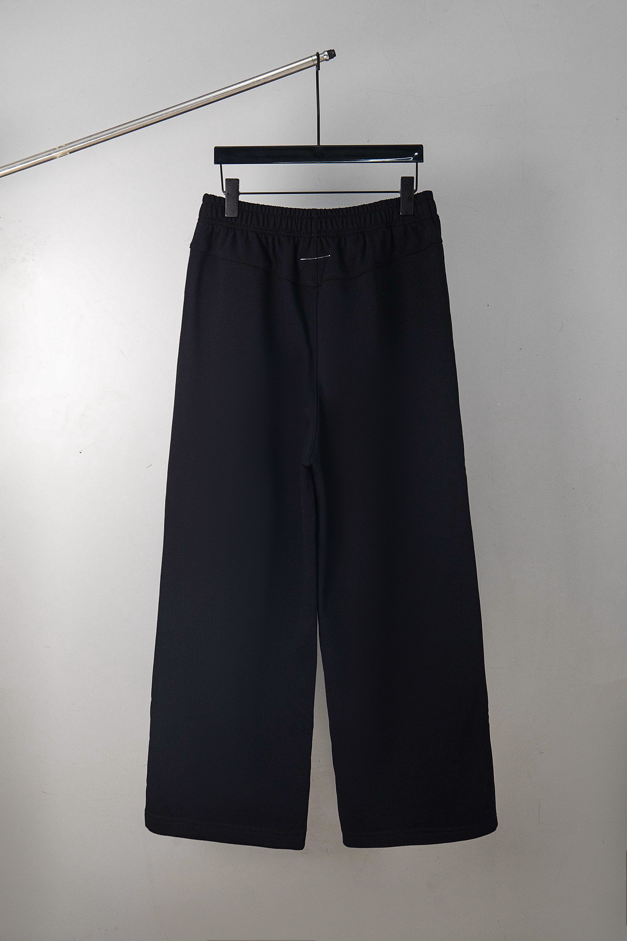 Dark navy wide-leg pants with elastic waistband and relaxed fit