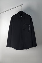 Black button-up shirt with front logo graphic, long sleeves