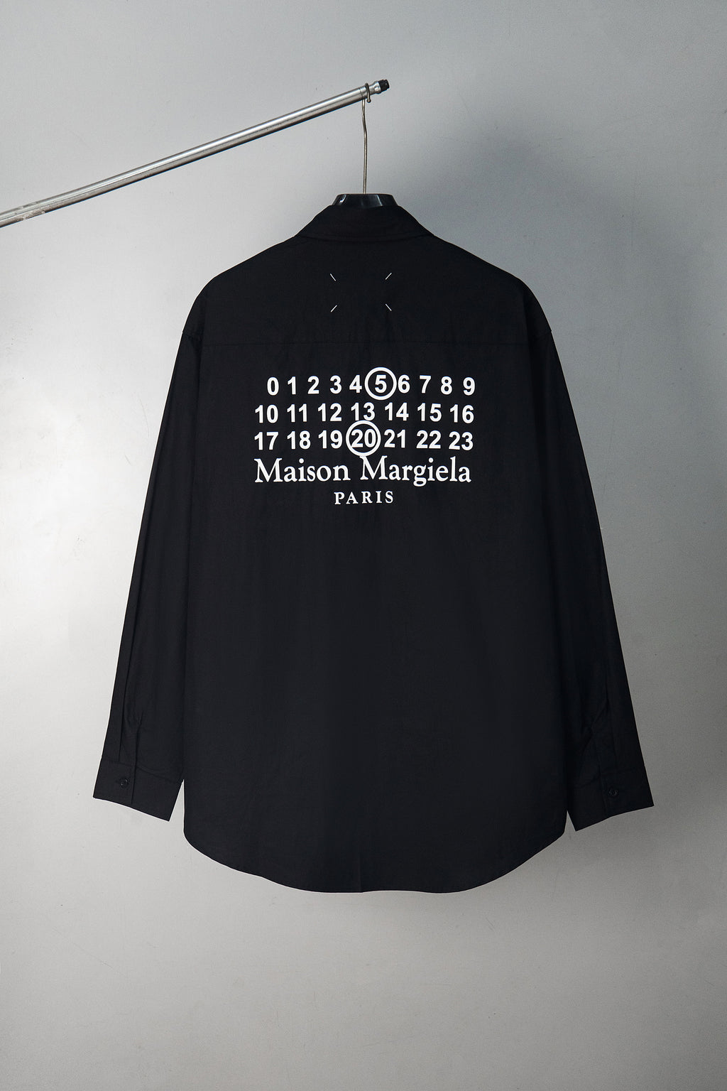 Black button-up shirt back with numbers and Maison Margiela Paris print