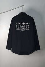 Black button-up shirt back with numbers and Maison Margiela Paris print