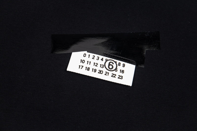 Black T-shirt chest logo label detail