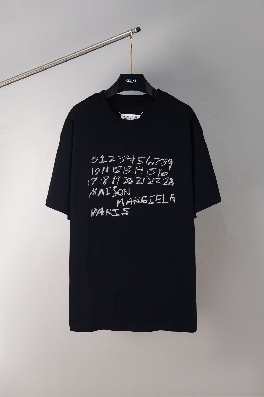 Maison Margiela black short-sleeve T-shirt with white scribble logo on chest