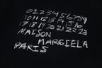 Maison Margiela black T-shirt front with white scribble logo lettering