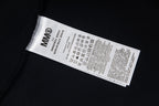 Maison Margiela T-shirt neck label on black fabric