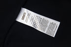 Black T-shirt inner neck label with care information