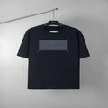Black short-sleeve T-shirt with gray rectangular graphic at center front