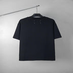 Black short-sleeve T-shirt, back view, with small brand details at collar