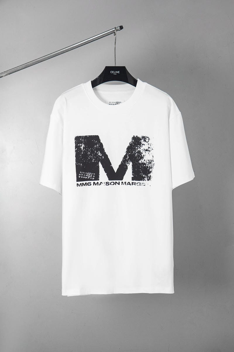 White graphic T-shirt with large distressed M logo print
