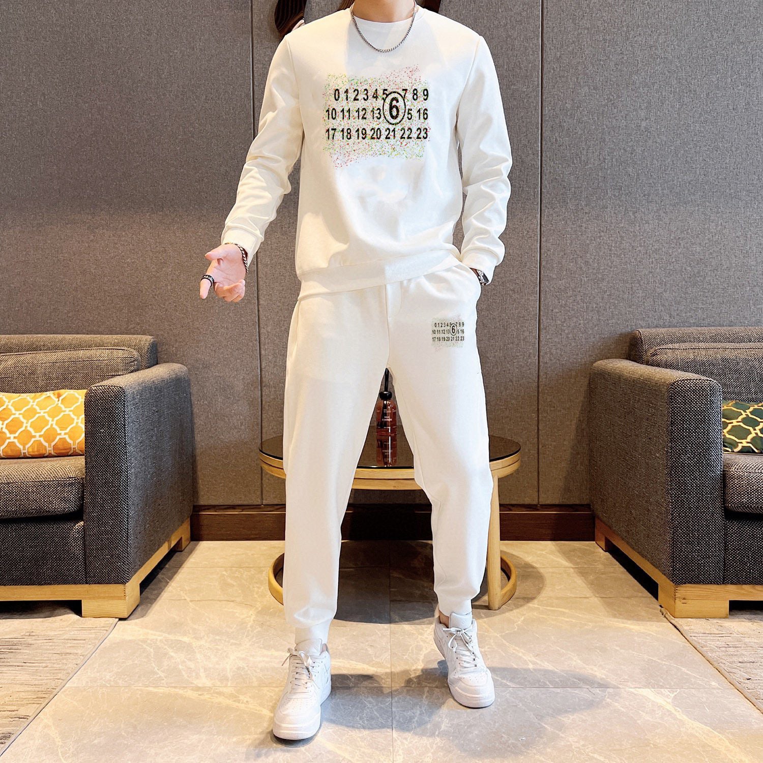 White crewneck sweatshirt and jogger pants set with number print on chest