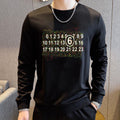 Black crewneck sweatshirt with graphic number print across chest, long sleeves