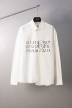 White button-up shirt with black number graphic and circled print at chest
