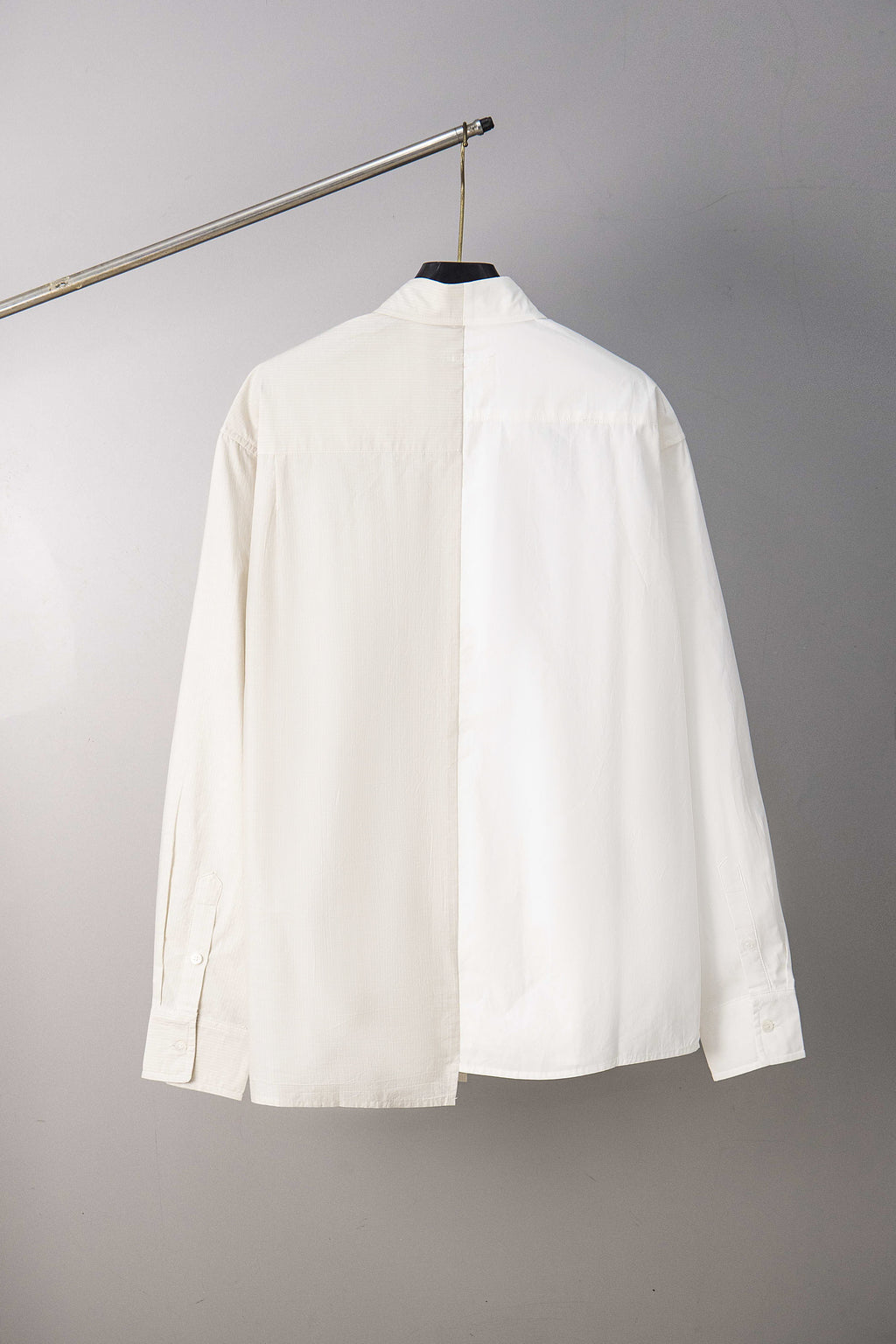 White button-up shirt back view with center seam and buttoned collar