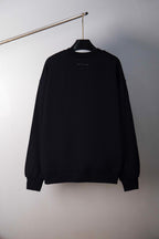 Black crewneck sweatshirt, plain front, hanging view