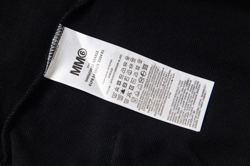Black hoodie with interior care label on stitched tag