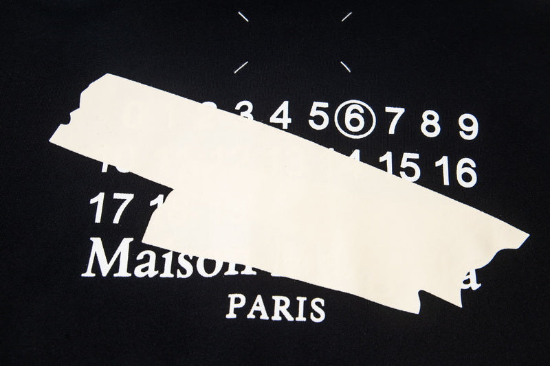 Black hoodie graphic with Maison Paris text and numbers 17–16