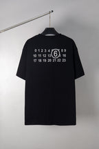 Maison Margiela black T-shirt with back number and logo print