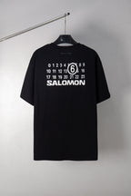 Black T-shirt with SALOMON graphic and number 6 print at chest
