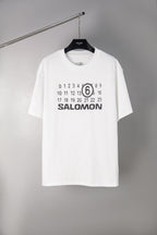 White T-shirt with SALOMON graphic and number 6 print at chest