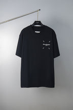 Black Maison Margiela T-shirt with small chest logo graphic and crew neck