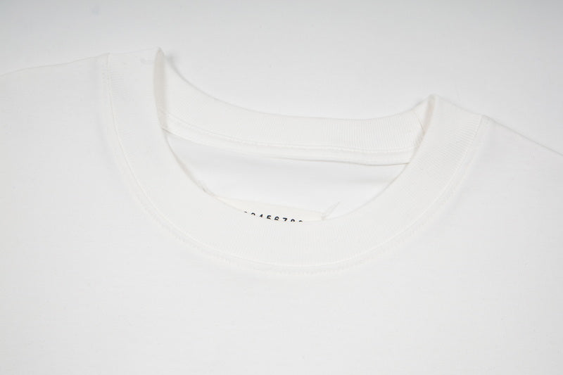 White crewneck T-shirt neckline with printed logo inside the collar