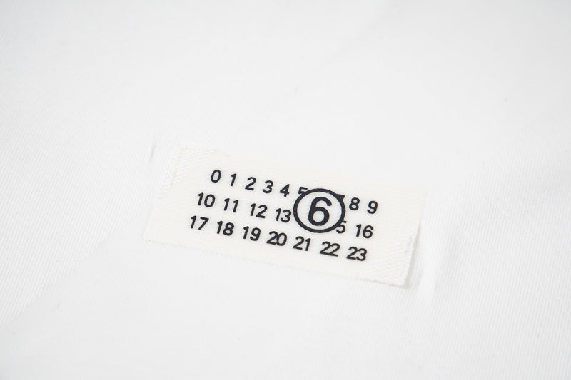 Maison Margiela fabric label with circled 6 logo and number grid