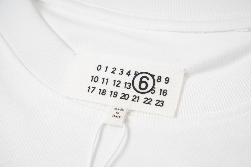 Maison Margiela collar label with circled 6 logo and number grid