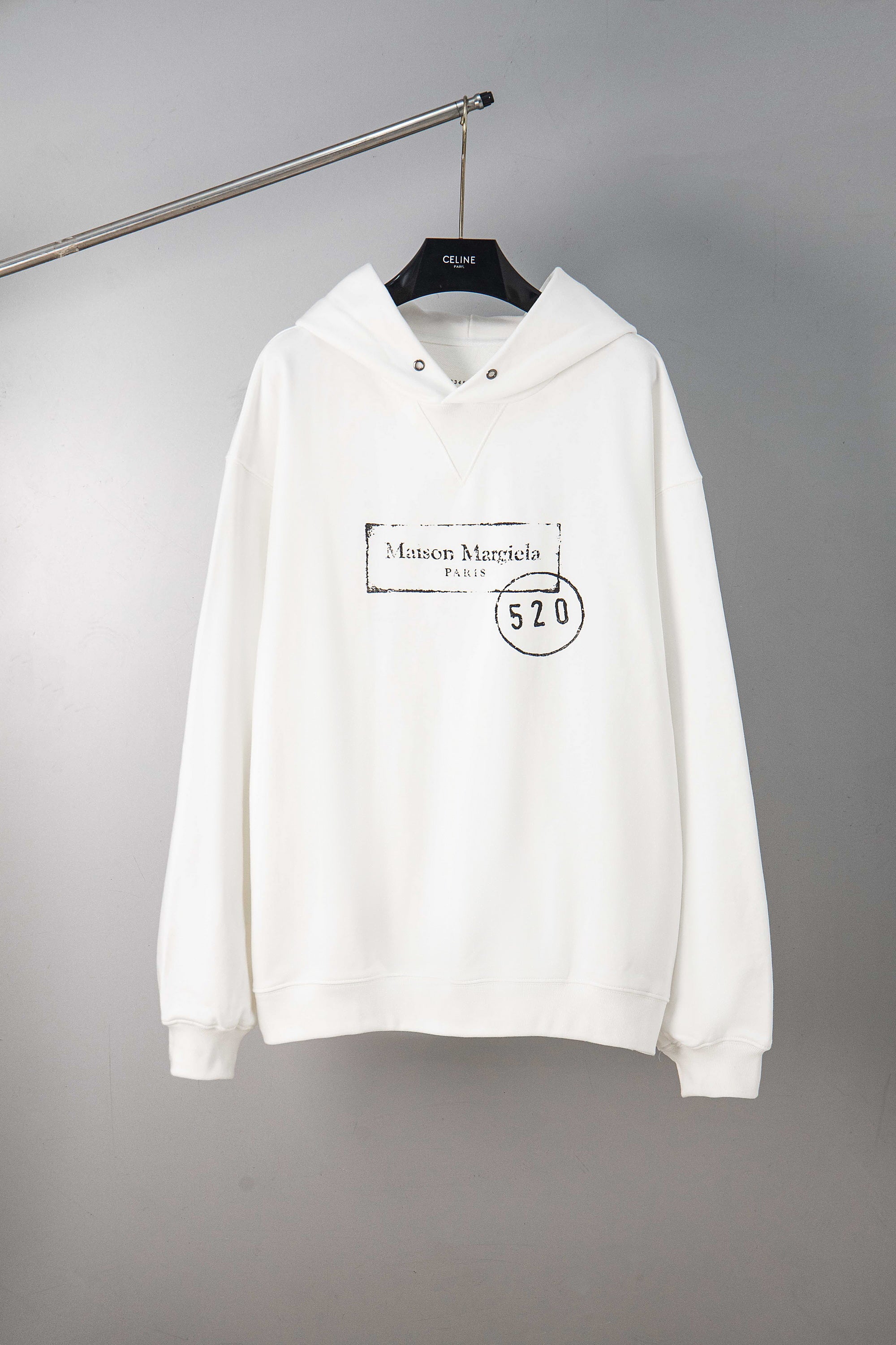 Maison Margiela pullover hoodie in white, with hood and front kangaroo pocket.