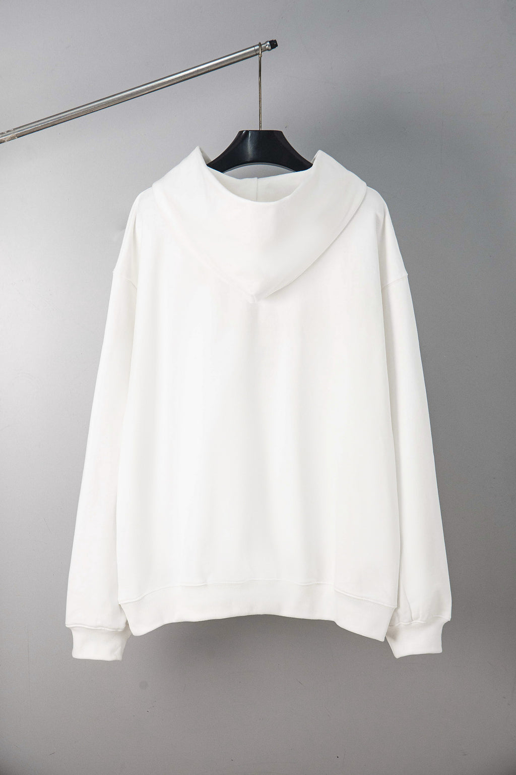 Maison Margiela pullover hoodie in white, back view with hood and long sleeves.