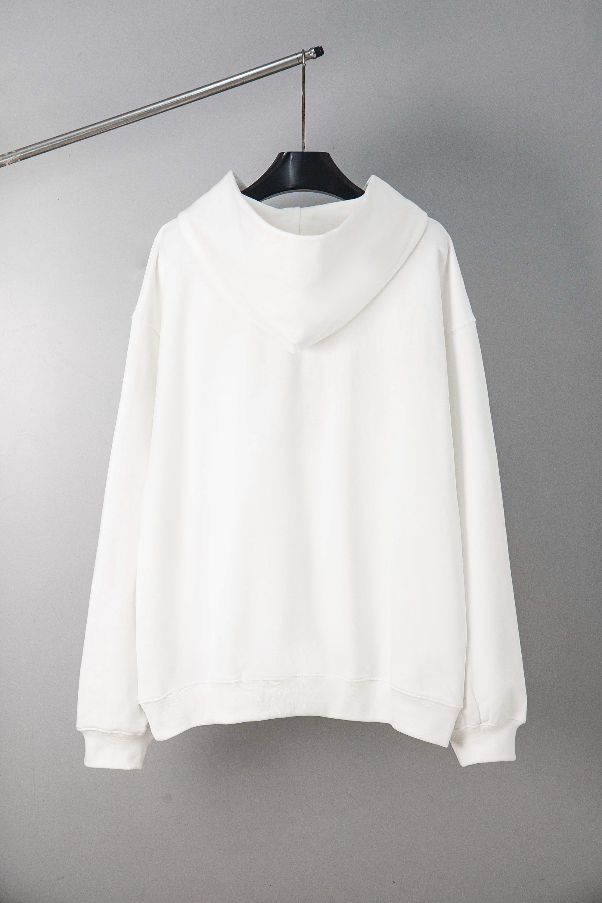 Maison Margiela pullover hoodie in white, back view with hood and long sleeves.