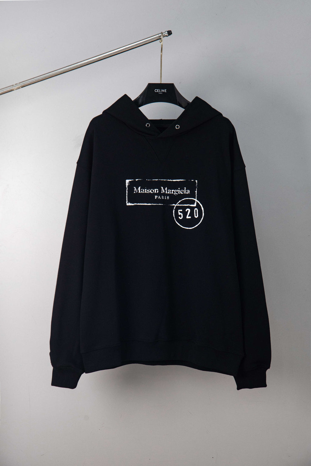 Maison Margiela pullover hoodie in dark, with hood and front kangaroo pocket.