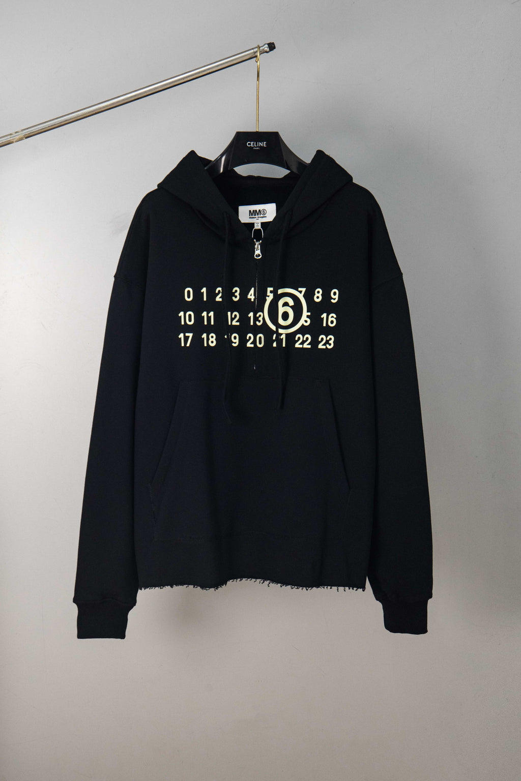 Black MM6 Maison Margiela hooded sweatshirt with half-zip, number graphic, drawstring