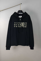 Black MM6 Maison Margiela hooded sweatshirt with half-zip, number graphic, drawstring