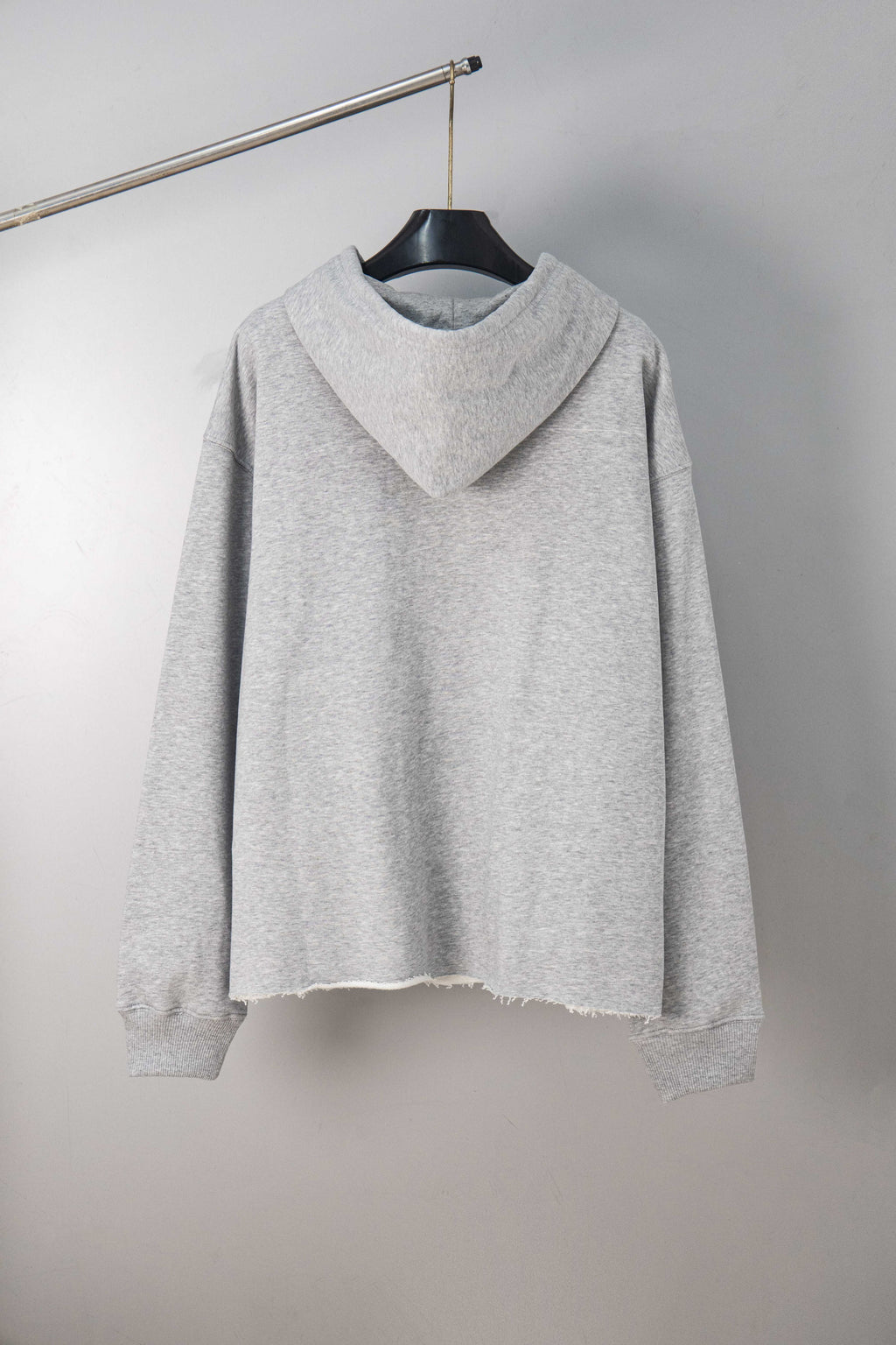 Light grey MM6 Maison Margiela hooded sweatshirt with frayed hem and front hood