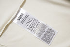 Cream T-shirt with brand care label at the neckline