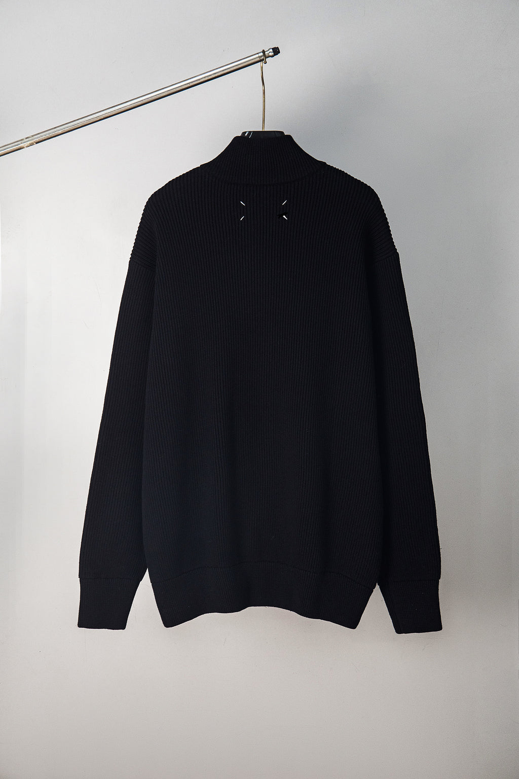 Black knit zip jacket, back view with stand collar and long sleeves