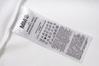 White fabric care label on a T-shirt
