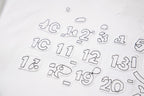 Close-up of gray numeric-style graphic print on T-shirt